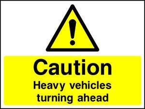 Caution Heavy vehicles turning ahead